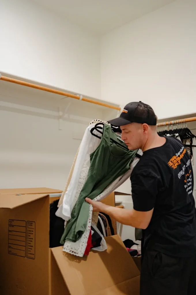 Service Pro Movers team packing boxes as the cheapest state to state movers in Sacramento