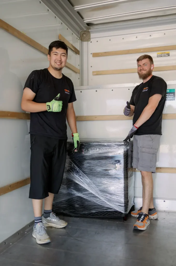 Smiling Service Pro Movers team loading a truck in Sacramento