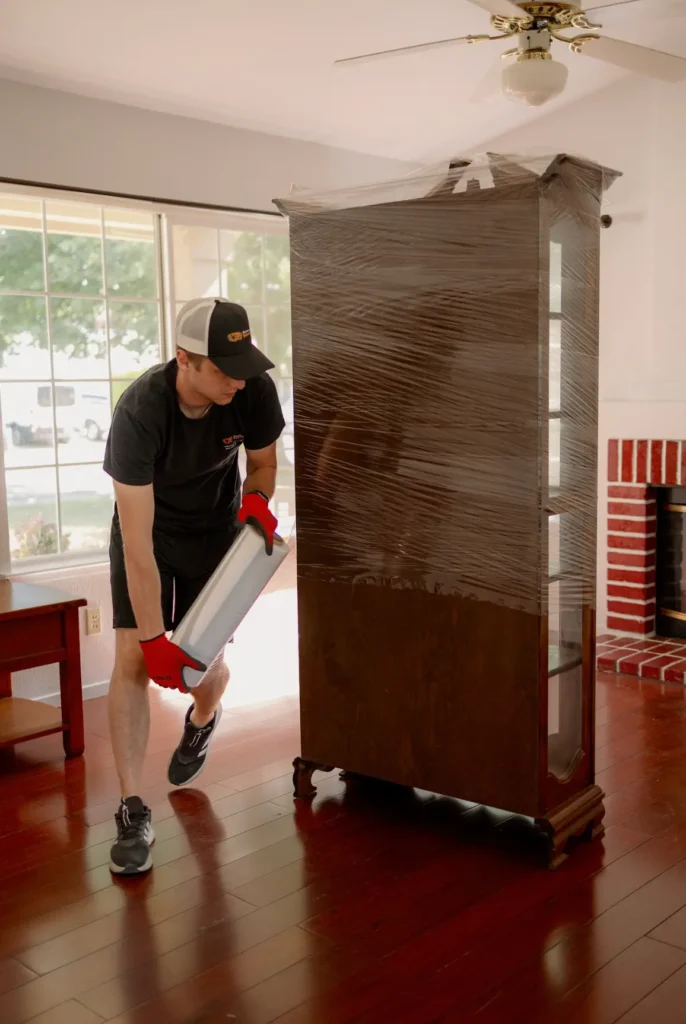 Professional movers from Service Pro Movers packing items in a Sacramento CA home, showcasing options for moving services