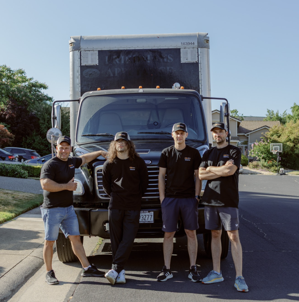 movers packing office furniture and computers during business relocation