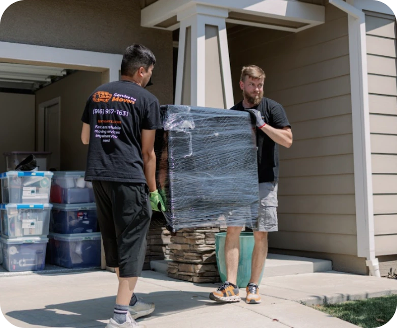 Movers carrying boxes