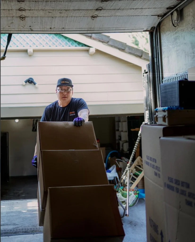 Commercial movers loading boxes into a moving truck in Sacramento